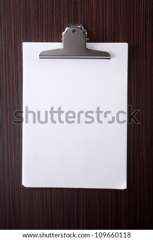 Stack of blank white paper with clip