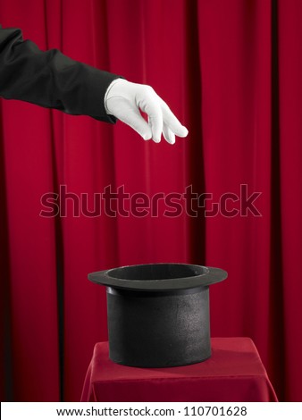 Magician picking some thing from top hat