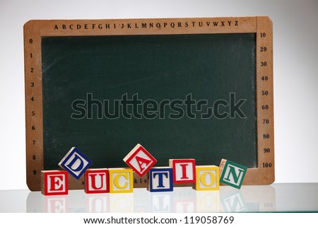 close up of the alphabet blocks in front of the black board