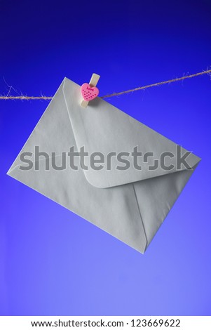 Close up on white Envelope on clothes line