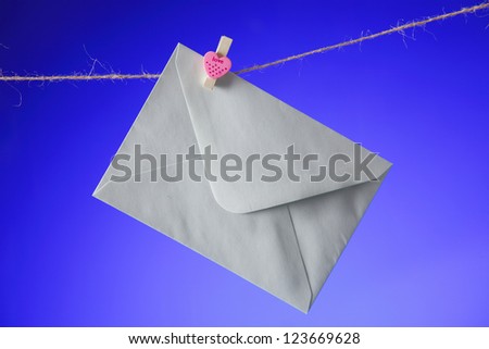 Close up on white Envelope on clothes line