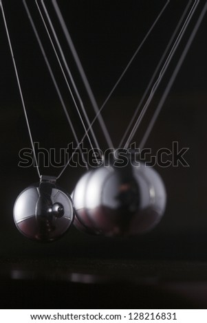 A chrome ball on a newtons cradle out of align