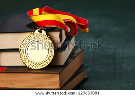 Gold medal on the book