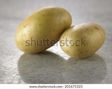 two potatoes on the marble table