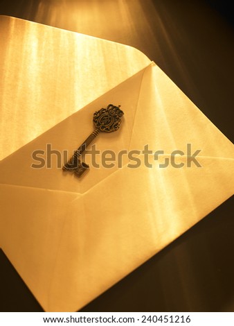 ray of light fall on key and envelope