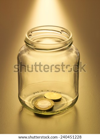 close up nearly empty saving jar