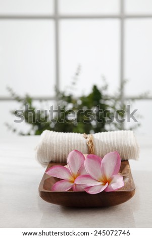 spa concept flower and the hand towel in a bath room