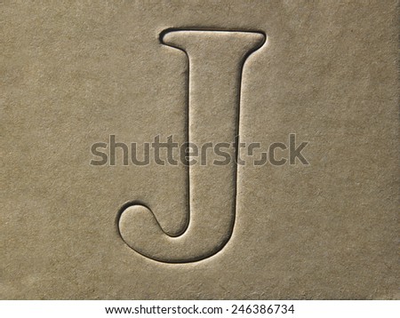 die cut alphabet j on the brown card board