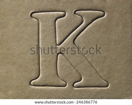 die cut alphabet k on the brown card board