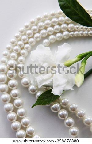 jasmine flowers and pearl necklace