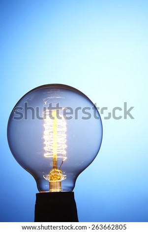 light bulb glow in the blue back ground