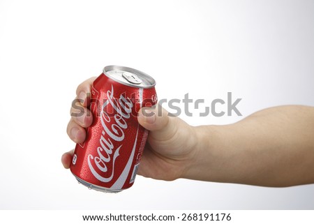 Kuala Lumpur,Malaysia 9th April 2015, hand holding a red Coca Cola can drinks.Coca Cola drinks are produced and manufactured by The Coca-Cola Company