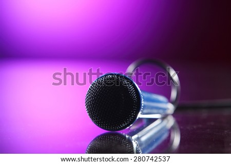 microphone with cable on the purple background