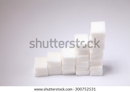Ascending stacks of sugar cubes - high blood sugar risk concept