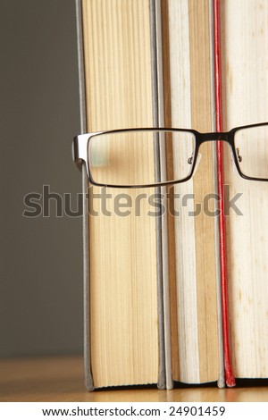 book and spectacles form like human wearing spectacle