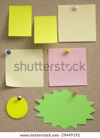 different size and type of paper on the notice board
