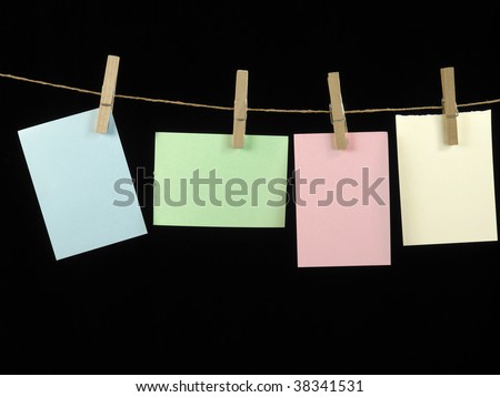washing line clipped with different type size of paper