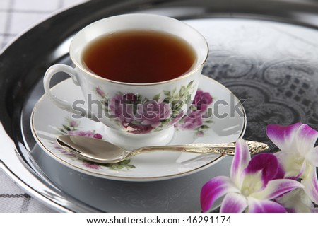 cup of tea on the silver serving tray