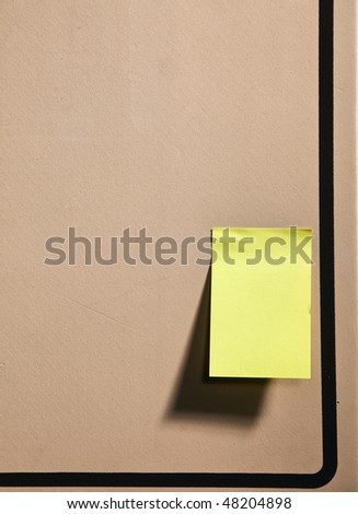 single yellow note on the memo board