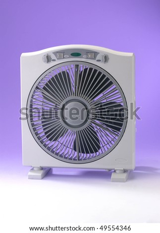 Modern desk cooling fan over white and purple background.