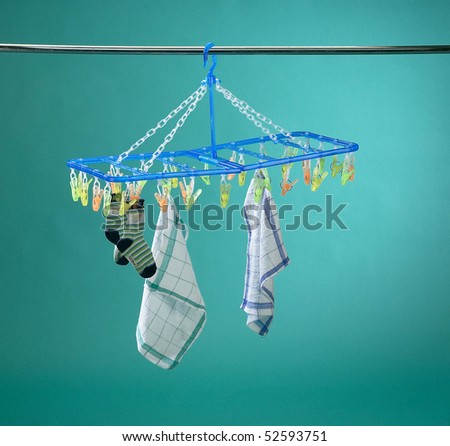 Baby socks and napkins hanging on the washing line.
