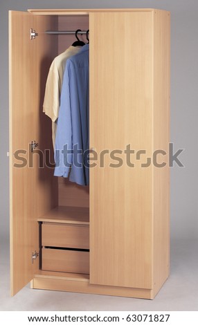 wardrobe with clothes on a plain background