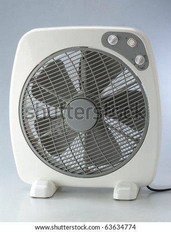 Modern desk cooling fan over plain background.