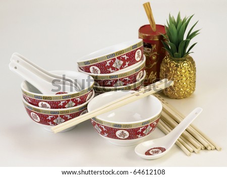 Traditional chinese table serving set: Chinese bowl, spoon and chopsticks.