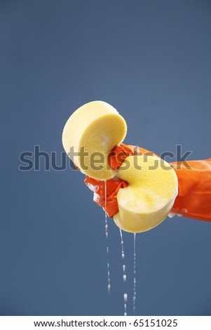 stock photo : Squeezing sponge