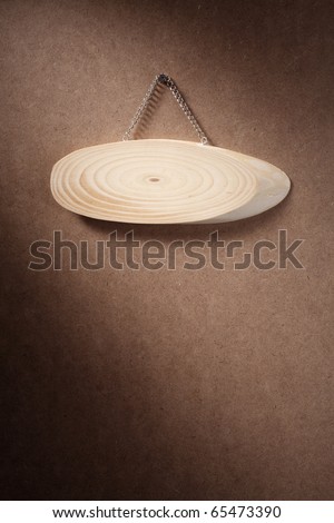 Oval wooden sign isolated on white background.