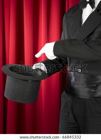 magician offer / showing his empty hat.