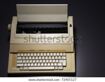 Typewriter isolated on the black background.