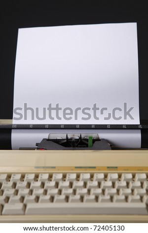 Typewriter with a piece of paper inserted.
