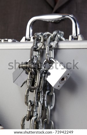 man holding the brief case with extra lock