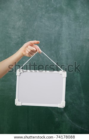 stock image of the hand holding white board