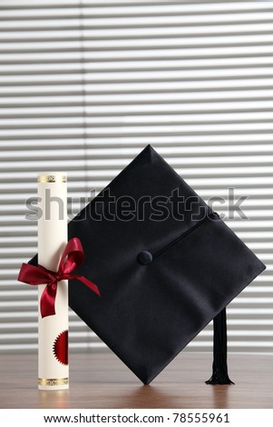 stock image of the mortar board  and certificate