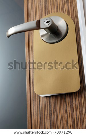 stock image of the door knob hanging with message note