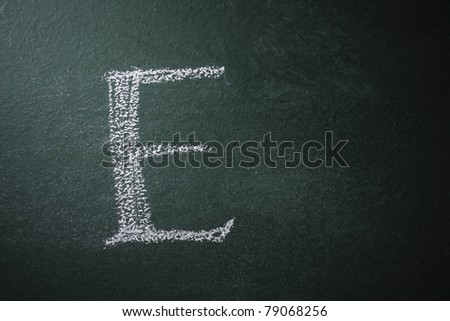 free hand writing alphabet on the black board