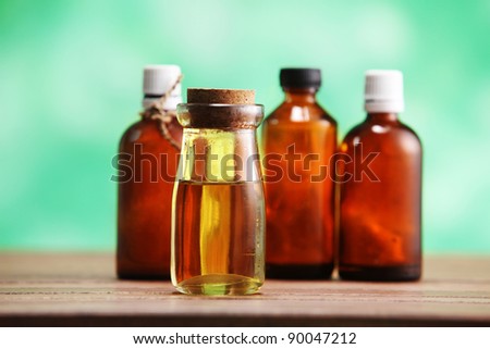 group of the massage oil on the wooden table