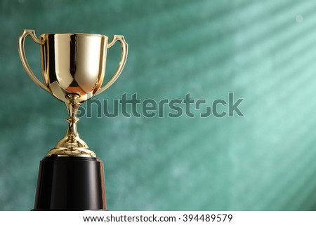 trophy in front of blackboard with light ray effect
