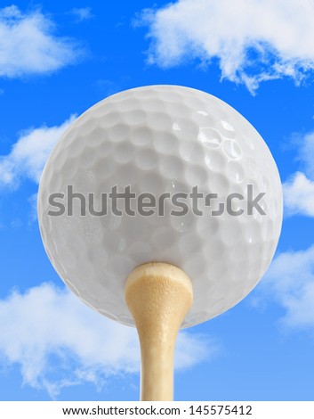 White Golf Ball on a Tee with a blue sky background