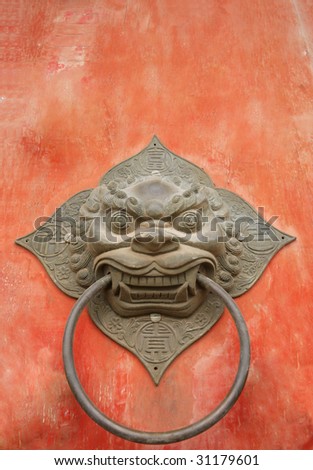 traditional Chinese door knocker on a Buddhist temple