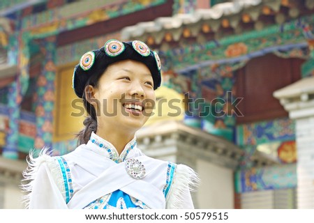 Pretty Chinese girl in the traditional clothes of the Naxi minority culture