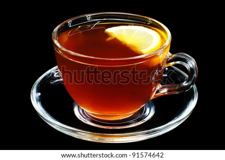 A cup of Tea with a Slice of Lemon, isolated on black