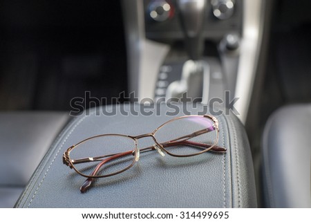 Polarized night driving glasses in dark leather car interior