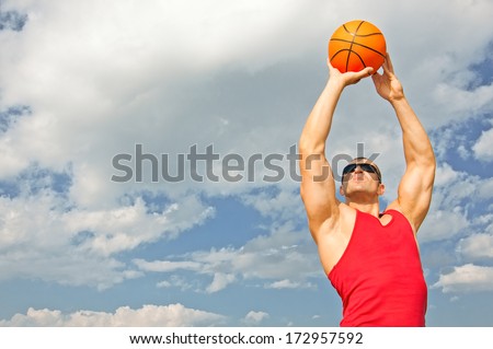 big beefy guy in a red shirt playing basketball