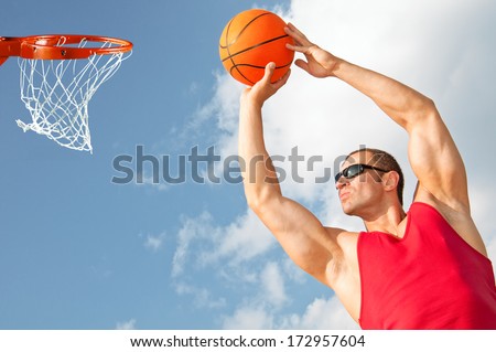 big beefy guy in a red shirt playing basketball