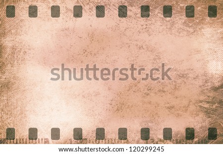 Grunge film strip frame on old paper sheet