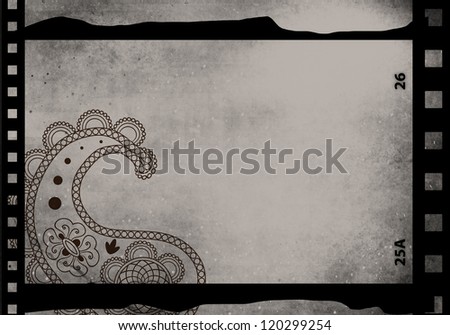 Grained film strip abstract grunge texture with paisley ornament