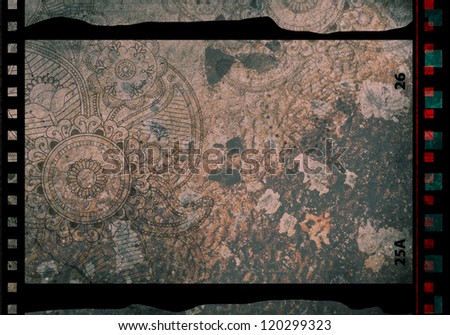 Grained film strip abstract grunge texture with paisley ornament